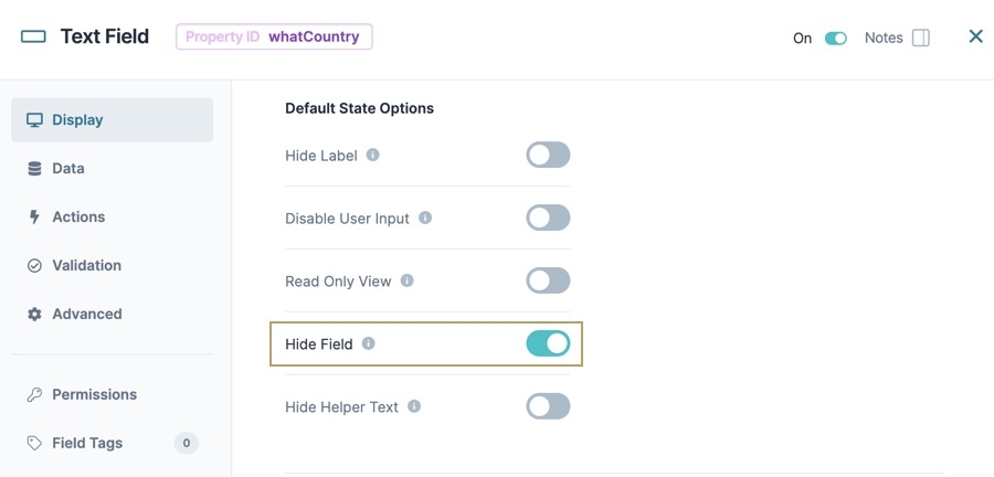 A static image dislaying the Text Field component's configuration window. The Display panel is selected and the Deault State Options section is shown. The Hide Field setting is toggled to ON.